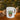 Glossy white ceramic mug with cute potted succulent and "I Wet My Plants" lettering on windowsill