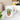 Glossy white ceramic mug with cute potted succulent and "I Wet My Plants" lettering on windowsill